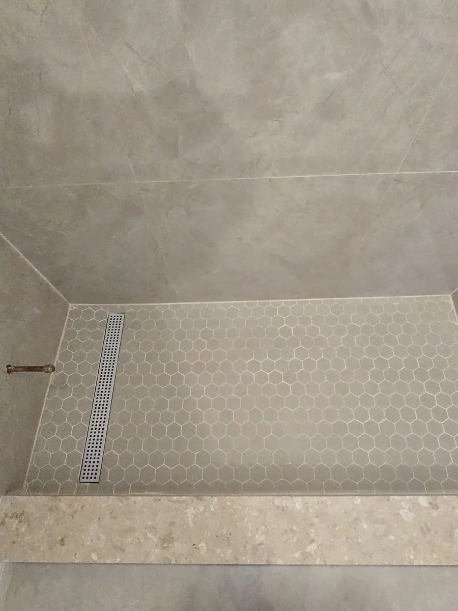 Shower pan with hexagon mosaic and a linear drain