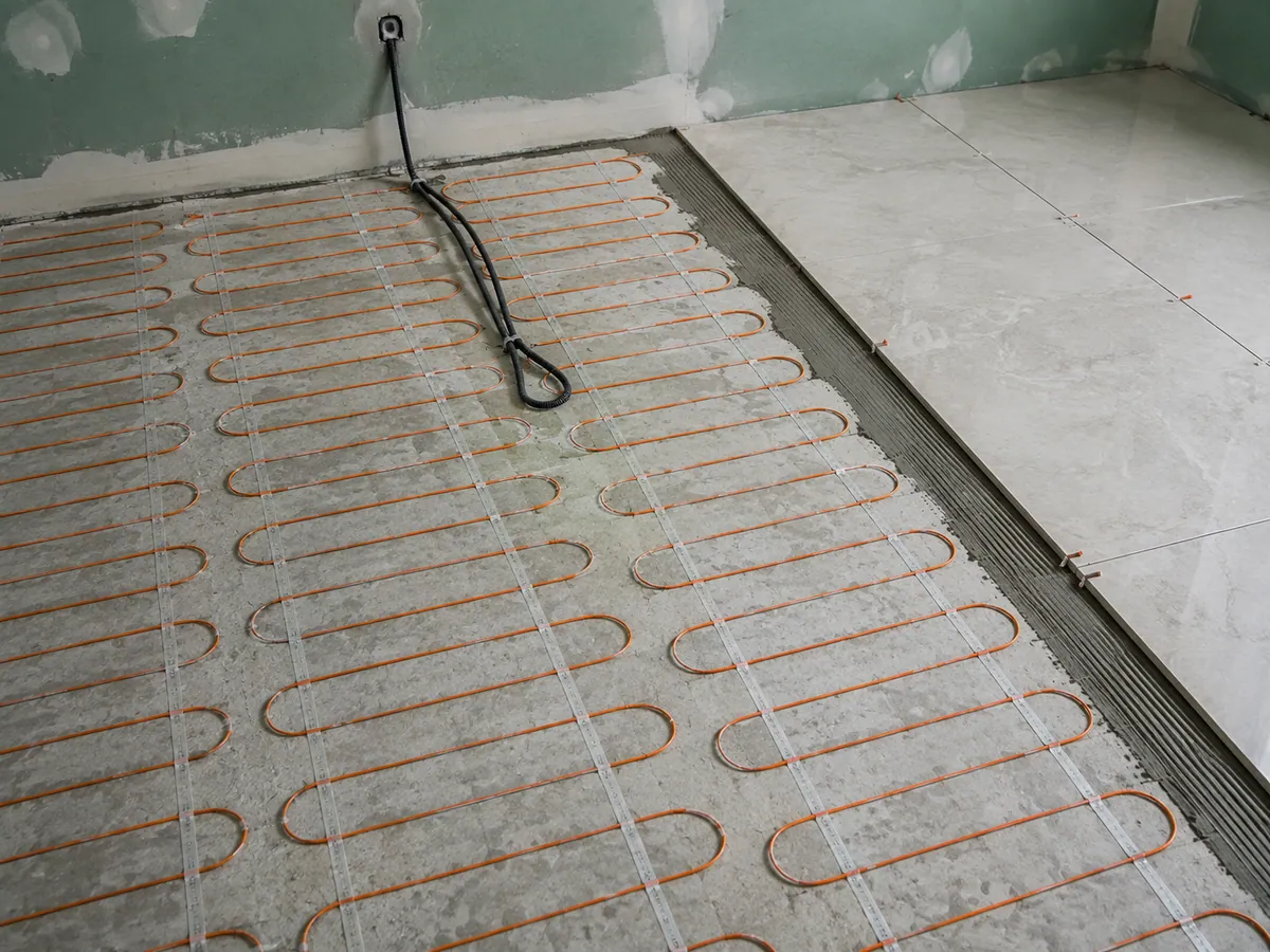 Electric heated floor mat installed under tile